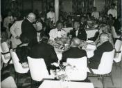 Fotografia de Américo Tomás, acompanhado por Gertrudes Rodrigues Tomás, a bordo do paquete Príncipe Perfeito, por ocasião do regresso da visita de estado efetuada a Moçambique, durante o qual fez paragem em Angola